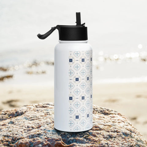 Stainless steel water bottle with a straw lid